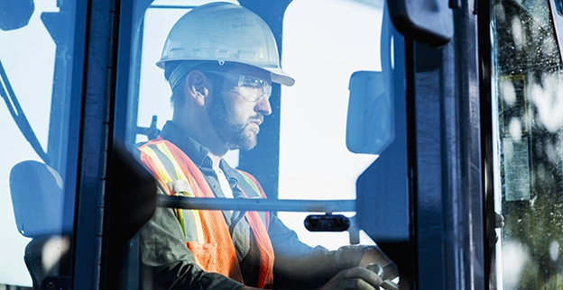 A picture of a silver sedan with tinted side windows.