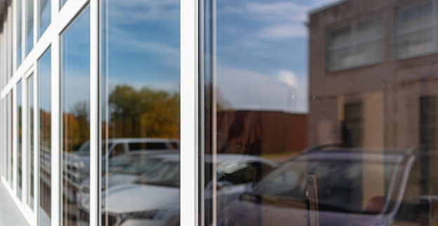 A picture of a commercial storefront with glass windows.