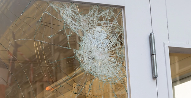 A picture of shattered home glass window panes.
