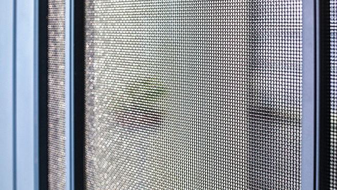 A closeup of a window screen.