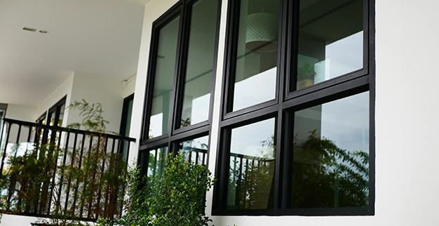 A picture of tinted windows on the front of a home.