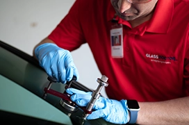 Glass Doctor professional repairing car windshield.