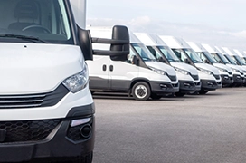Vans in a parking lot.