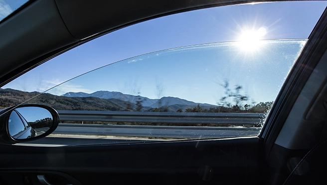 Sun flare shining thru a right window car in movement.