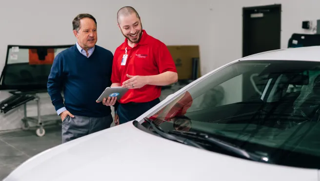 Glass Doctor professional explaining the windshield protection plan.
