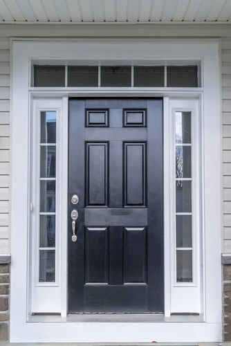 Black front door with sidelights