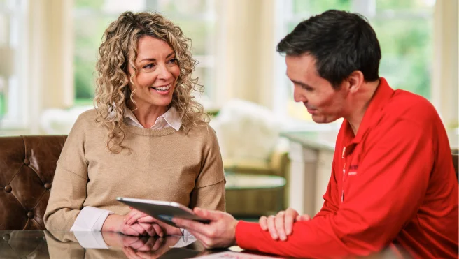 Glass Doctor professional talking to customer about financing.