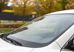 A close-up of a white car's windshield.