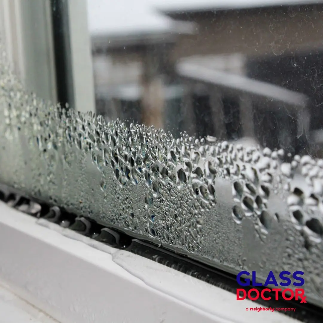 Ice and frost forming on residential window glass during winter in Meridian ID due to poor insulation and air leaks