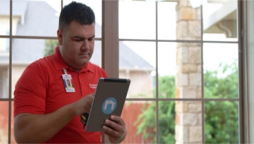 A Glass Doctor Specialist in front of a window